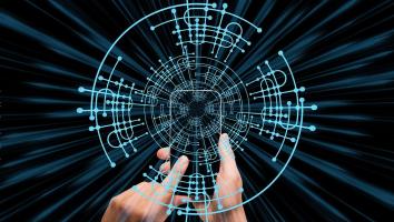 A persons hands gesture towards an intricate, circular digital interface with blue lines and nodes. The background features a dynamic, abstract pattern of radiating dark streaks, giving a sense of speed and technology.
