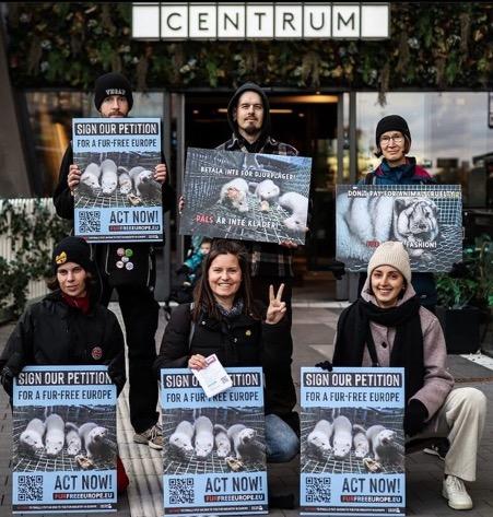 A group of people holding signs